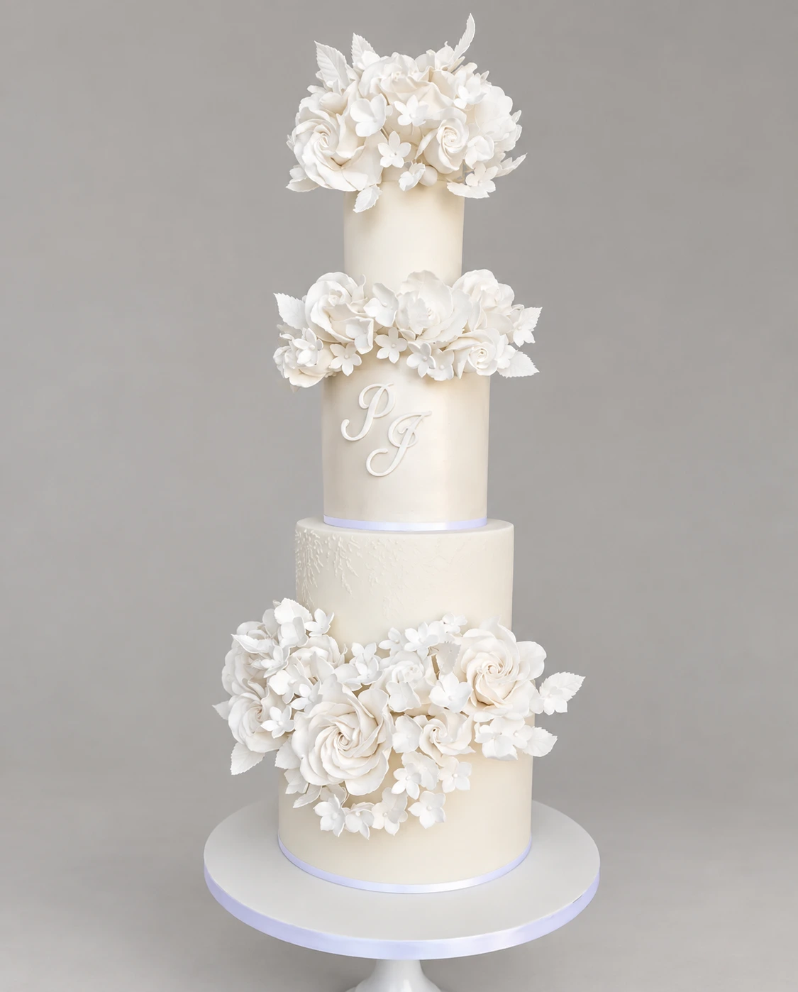 White Floral Wreaths Wedding Cake — 4 cake tiers