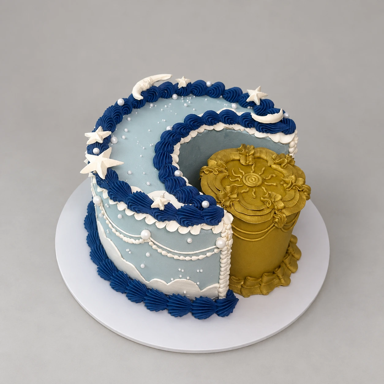 Sculpted pale blue crescent moon and gold sun cake with stars, pearls and decorative piping
